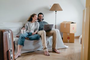 couple sitting in a newly moved into room